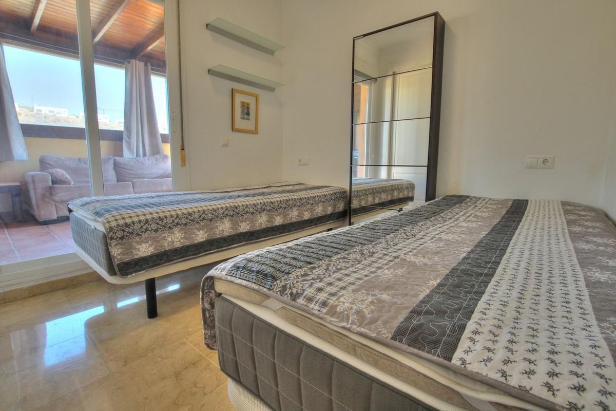 Penthouse with easy walk to La Cala de Mijas, featuring communal pool, paddle court, large terrace with sun all day, enclosed extra room, bright lounge, separate kitchen, en-suite bathroom, underground parking.