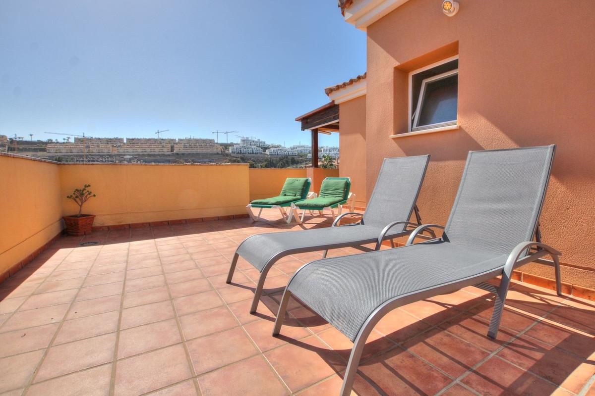 Penthouse with easy walk to La Cala de Mijas, featuring communal pool, paddle court, large terrace with sun all day, enclosed extra room, bright lounge, separate kitchen, en-suite bathroom, underground parking.