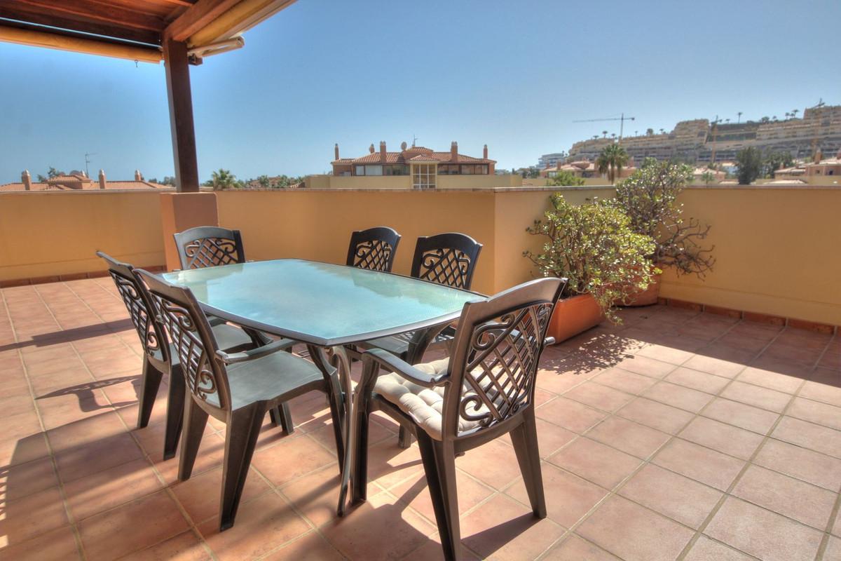 Penthouse with easy walk to La Cala de Mijas, featuring communal pool, paddle court, large terrace with sun all day, enclosed extra room, bright lounge, separate kitchen, en-suite bathroom, underground parking.