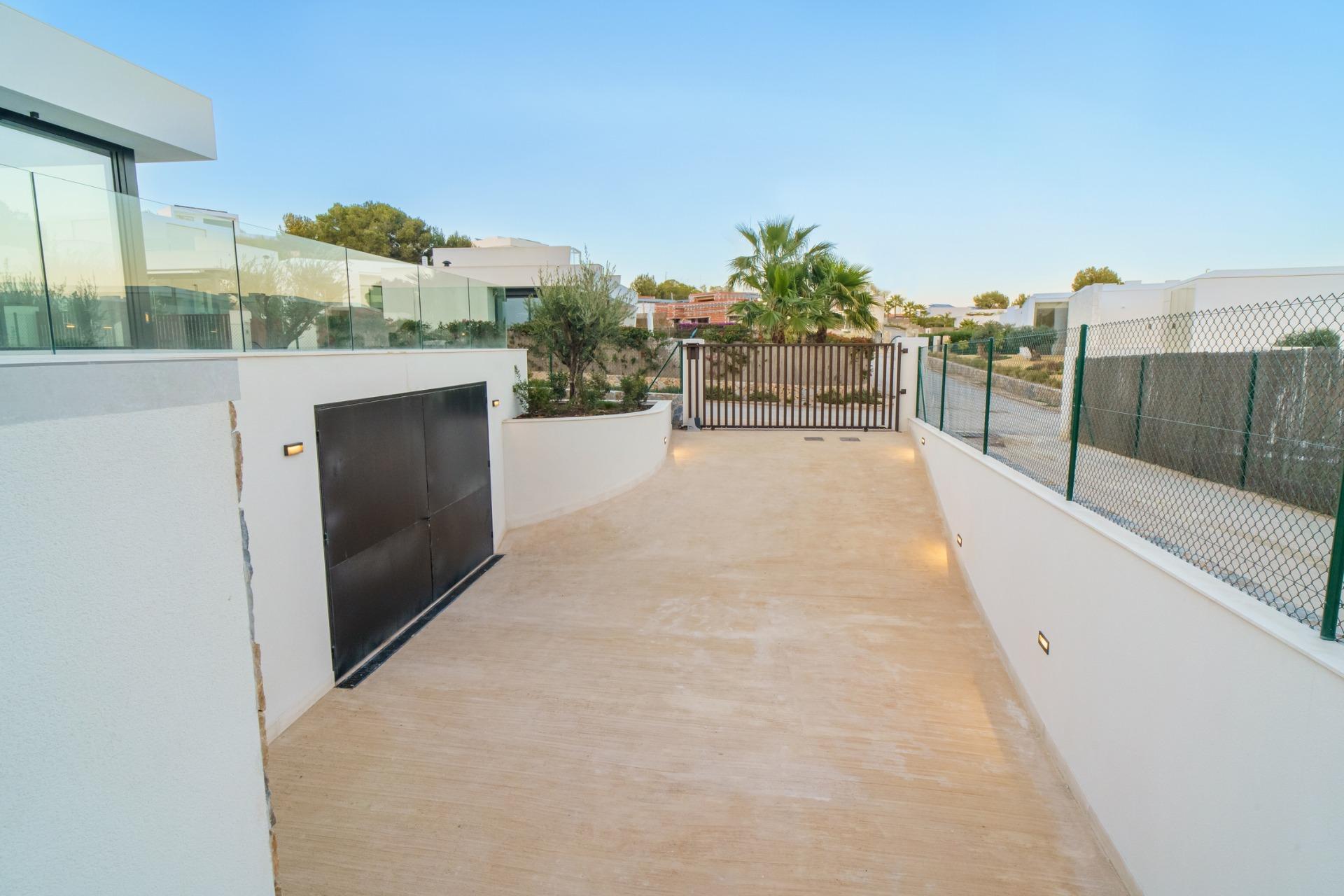 New build modern villa in Las Colinas Golf with 3 bedrooms, 3 bathrooms, open kitchen, spacious terraces, private garden with pool, and a garage basement. Surrounded by Mediterranean forest, offering privacy and close to amenities and beautiful landscapes.